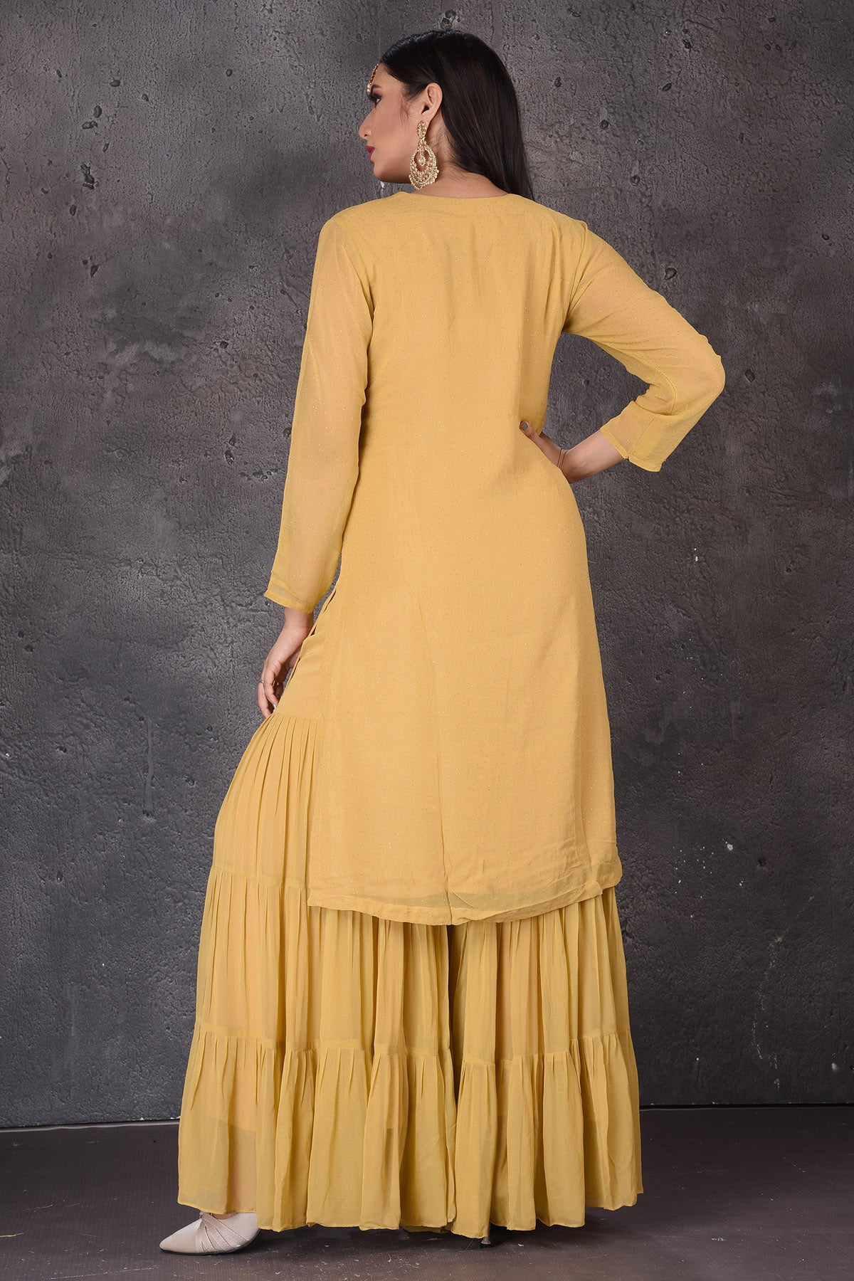 Buy beautiful yellow embroidered designer sharara suit online in USA with dupatta. Look elegant at weddings and festive occasions in exclusive designer suits, designer gowns, Anarkali suits, sharara suits, bridal gowns, palazzo suits, designer lehenga from Pure Elegance Indian clothing store in USA.-back