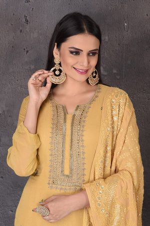 Buy beautiful yellow embroidered designer sharara suit online in USA with dupatta. Look elegant at weddings and festive occasions in exclusive designer suits, designer gowns, Anarkali suits, sharara suits, bridal gowns, palazzo suits, designer lehenga from Pure Elegance Indian clothing store in USA.-closeup