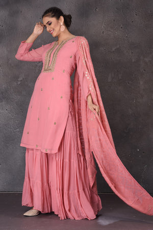 Shop stunning pink embroidered sharara suit online in USA with dupatta. Look elegant at weddings and festive occasions in exclusive designer suits, designer gowns, Anarkali suits, sharara suits, bridal gowns, palazzo suits, designer lehenga from Pure Elegance Indian clothing store in USA.-dupatta
