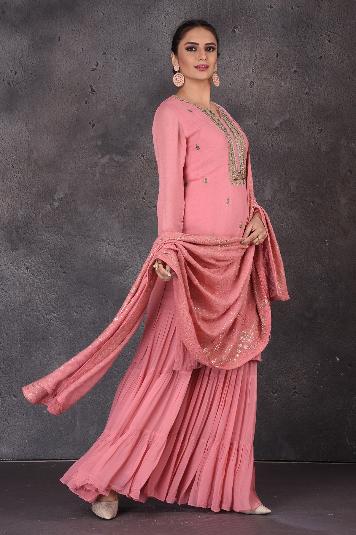 Shop stunning pink embroidered sharara suit online in USA with dupatta. Look elegant at weddings and festive occasions in exclusive designer suits, designer gowns, Anarkali suits, sharara suits, bridal gowns, palazzo suits, designer lehenga from Pure Elegance Indian clothing store in USA.-side