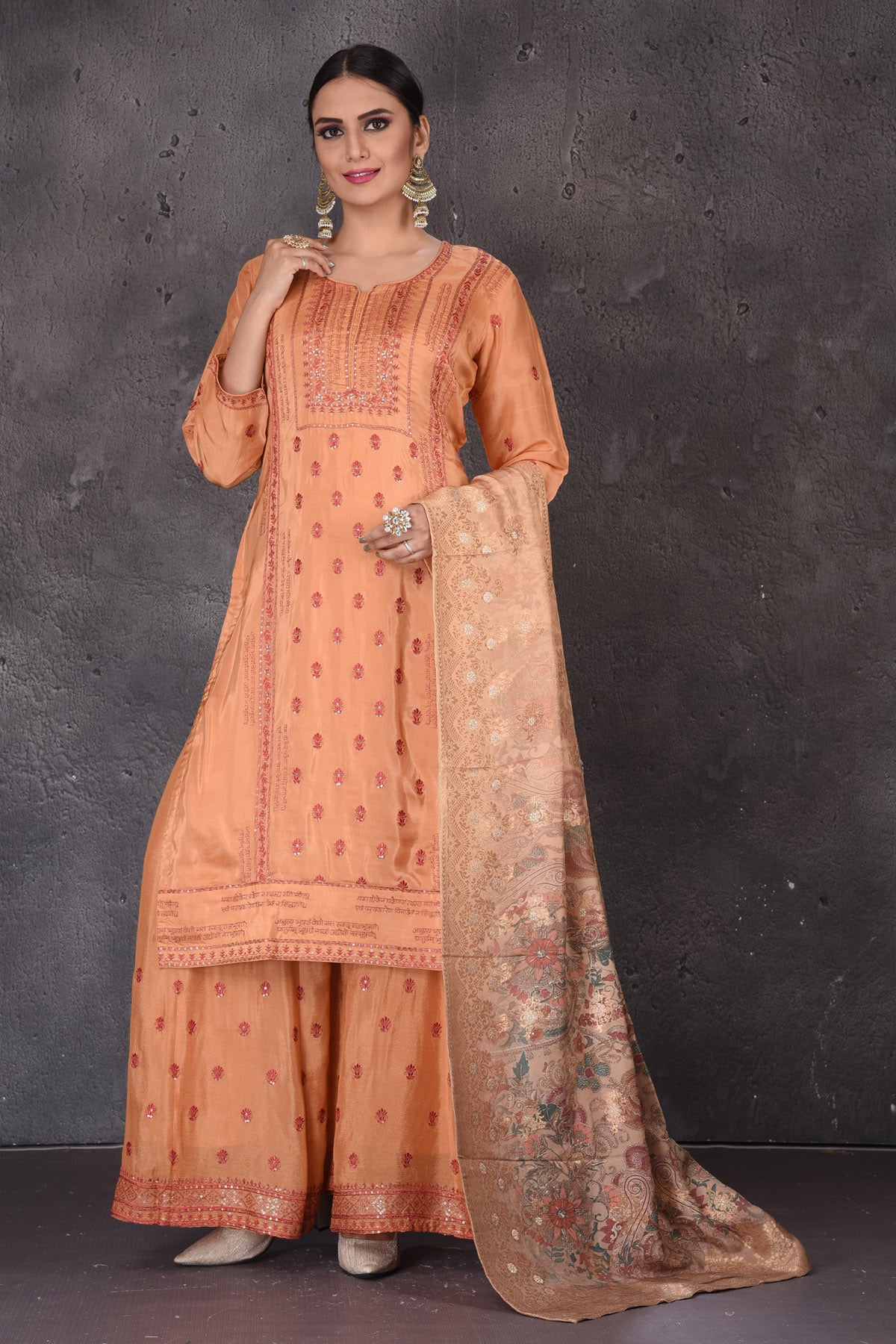 Shop beautiful orange embroidered palazzo suit online in USA with dupatta. Look elegant at weddings and festive occasions in exclusive designer suits, designer gowns, Anarkali suits, sharara suits, bridal gowns, palazzo suits, designer lehenga from Pure Elegance Indian clothing store in USA.-full view