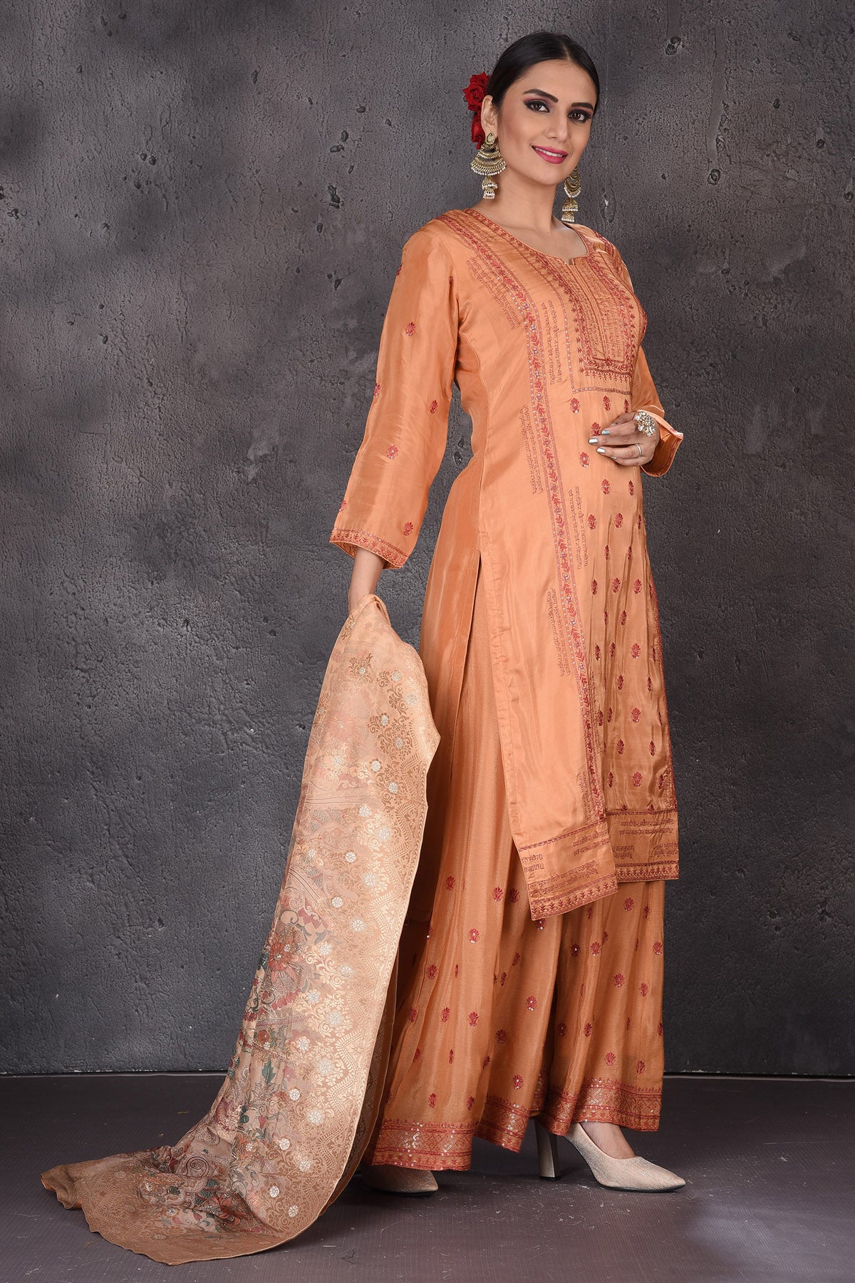 Shop beautiful orange embroidered palazzo suit online in USA with dupatta. Look elegant at weddings and festive occasions in exclusive designer suits, designer gowns, Anarkali suits, sharara suits, bridal gowns, palazzo suits, designer lehenga from Pure Elegance Indian clothing store in USA.-side