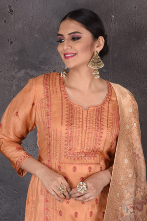 Shop beautiful orange embroidered palazzo suit online in USA with dupatta. Look elegant at weddings and festive occasions in exclusive designer suits, designer gowns, Anarkali suits, sharara suits, bridal gowns, palazzo suits, designer lehenga from Pure Elegance Indian clothing store in USA.-closeup