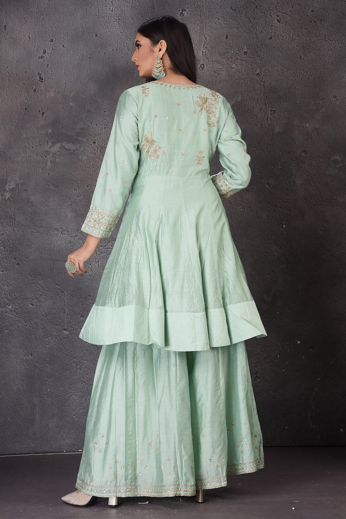 Shop beautiful mint green embroidered sharara suit online in USA with dupatta. Look elegant at weddings and festive occasions in exclusive designer suits, designer gowns, Anarkali suits, sharara suits, bridal gowns, palazzo suits, designer lehenga from Pure Elegance Indian clothing store in USA.-back