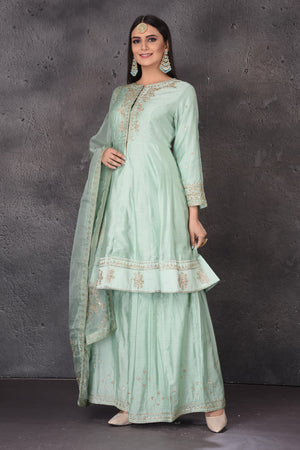 Shop beautiful mint green embroidered sharara suit online in USA with dupatta. Look elegant at weddings and festive occasions in exclusive designer suits, designer gowns, Anarkali suits, sharara suits, bridal gowns, palazzo suits, designer lehenga from Pure Elegance Indian clothing store in USA.-side