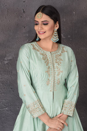 Shop beautiful mint green embroidered sharara suit online in USA with dupatta. Look elegant at weddings and festive occasions in exclusive designer suits, designer gowns, Anarkali suits, sharara suits, bridal gowns, palazzo suits, designer lehenga from Pure Elegance Indian clothing store in USA.-closeup