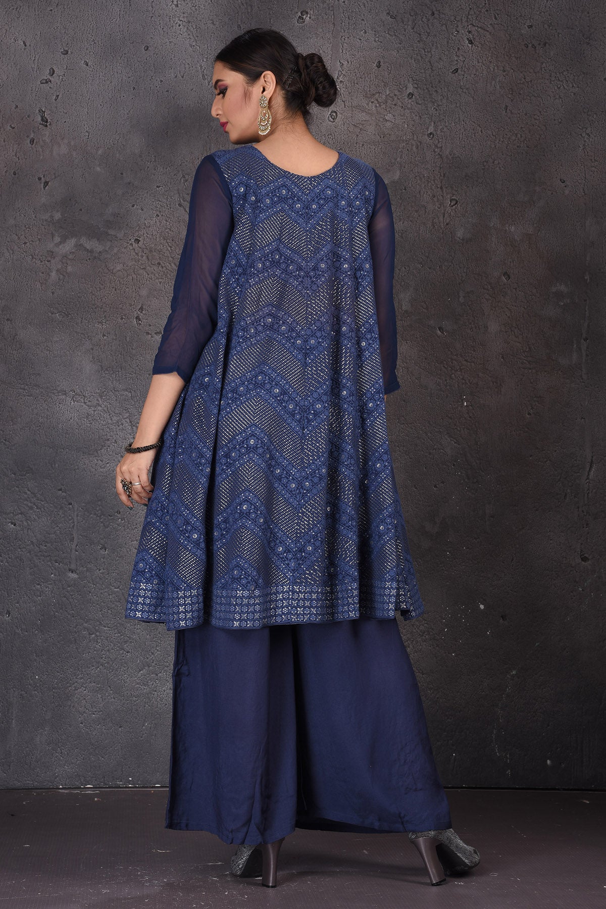 Buy beautiful dark blue palazzo suit online in USA with embroidered pink dupatta. Look elegant at weddings and festive occasions in exclusive designer suits, designer gowns, Anarkali suits, sharara suits, bridal gowns, palazzo suits, designer lehenga from Pure Elegance Indian clothing store in USA.-back