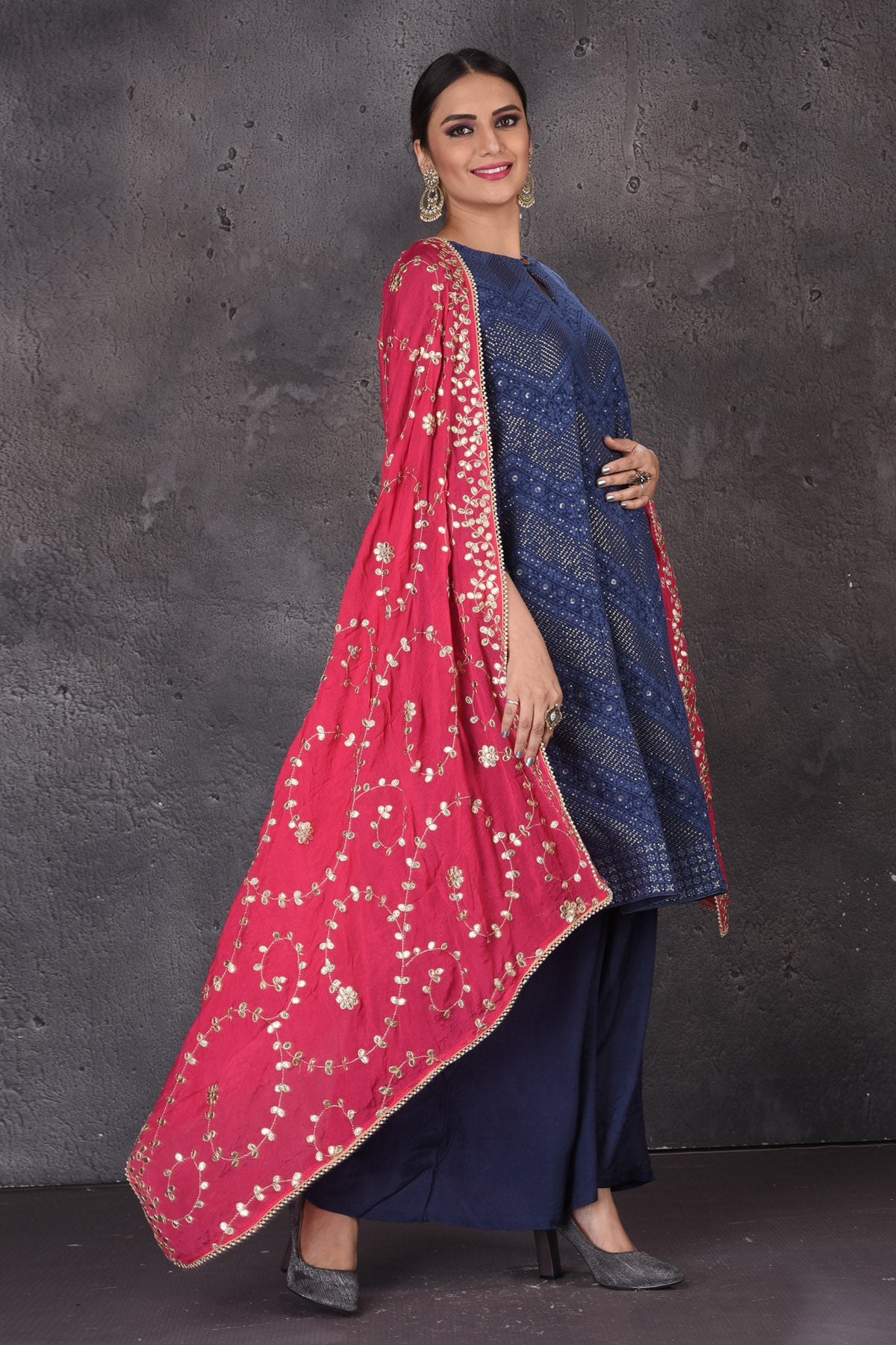 Buy beautiful dark blue palazzo suit online in USA with embroidered pink dupatta. Look elegant at weddings and festive occasions in exclusive designer suits, designer gowns, Anarkali suits, sharara suits, bridal gowns, palazzo suits, designer lehenga from Pure Elegance Indian clothing store in USA.-side