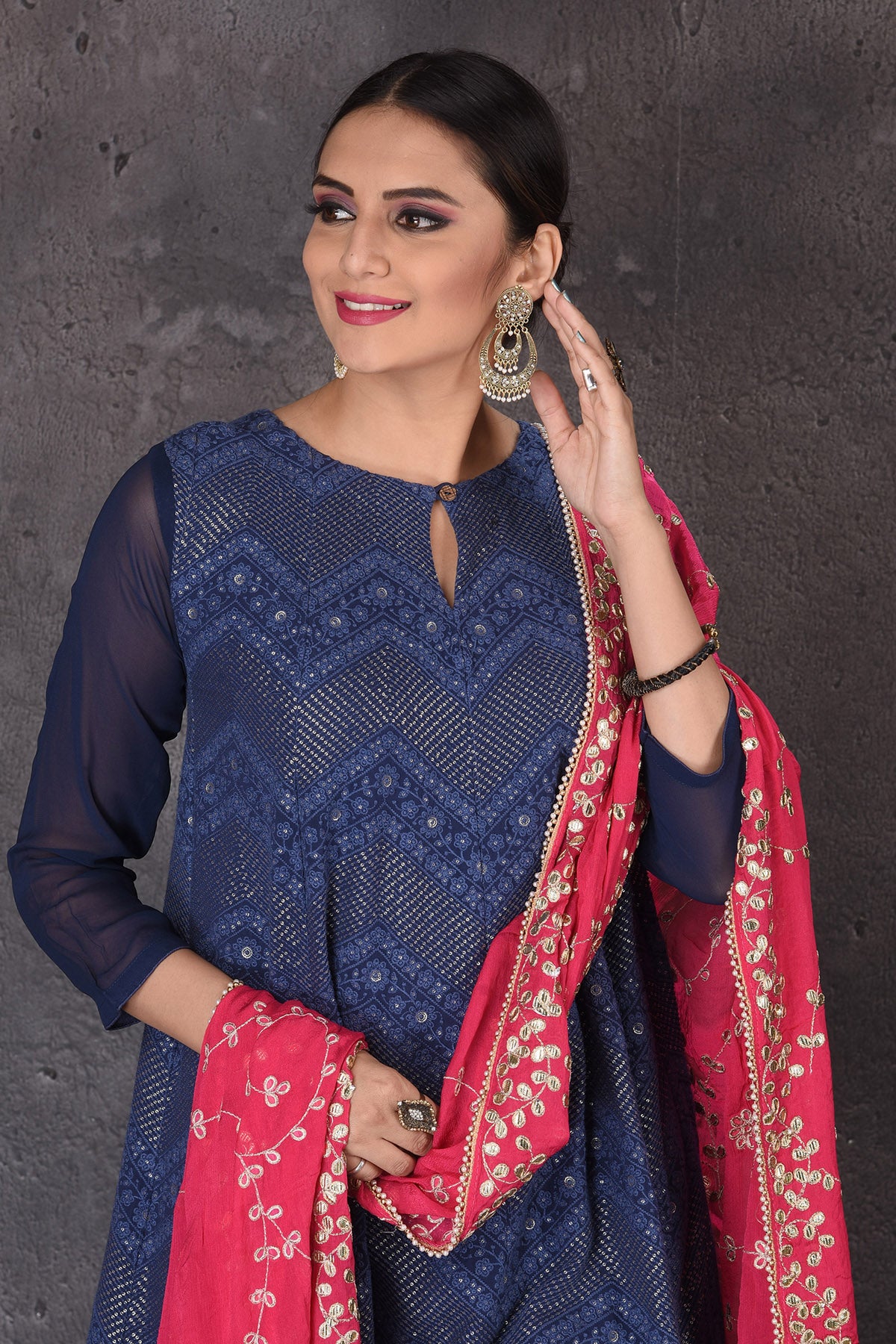 Buy beautiful dark blue palazzo suit online in USA with embroidered pink dupatta. Look elegant at weddings and festive occasions in exclusive designer suits, designer gowns, Anarkali suits, sharara suits, bridal gowns, palazzo suits, designer lehenga from Pure Elegance Indian clothing store in USA.-closeup