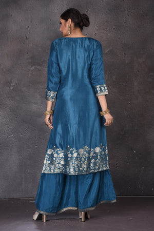 Buy stunning blue embroidered palazzo suit online in USA with grey dupatta. Look elegant at weddings and festive occasions in exclusive designer suits, designer gowns, Anarkali suits, sharara suits, bridal gowns, palazzo suits, designer lehenga from Pure Elegance Indian clothing store in USA.-back