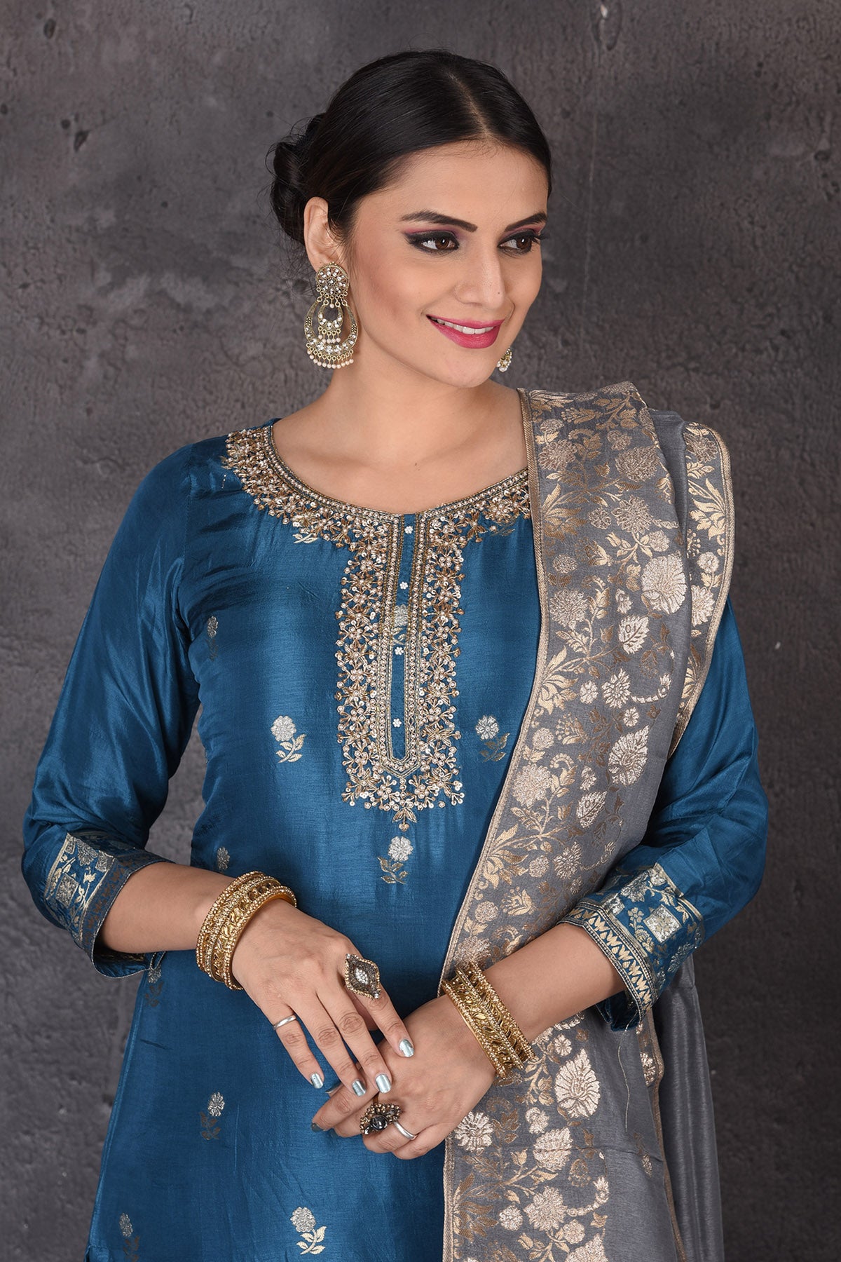 Buy stunning blue embroidered palazzo suit online in USA with grey dupatta. Look elegant at weddings and festive occasions in exclusive designer suits, designer gowns, Anarkali suits, sharara suits, bridal gowns, palazzo suits, designer lehenga from Pure Elegance Indian clothing store in USA.-closeup