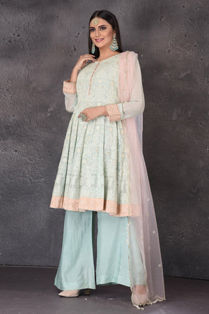 Buy gorgeous mint green embroidered sharara suit online in USA with pink dupatta. Look elegant at weddings and festive occasions in exclusive designer suits, designer gowns, Anarkali suits, sharara suits, bridal gowns, palazzo suits, designer lehenga from Pure Elegance Indian clothing store in USA.-side