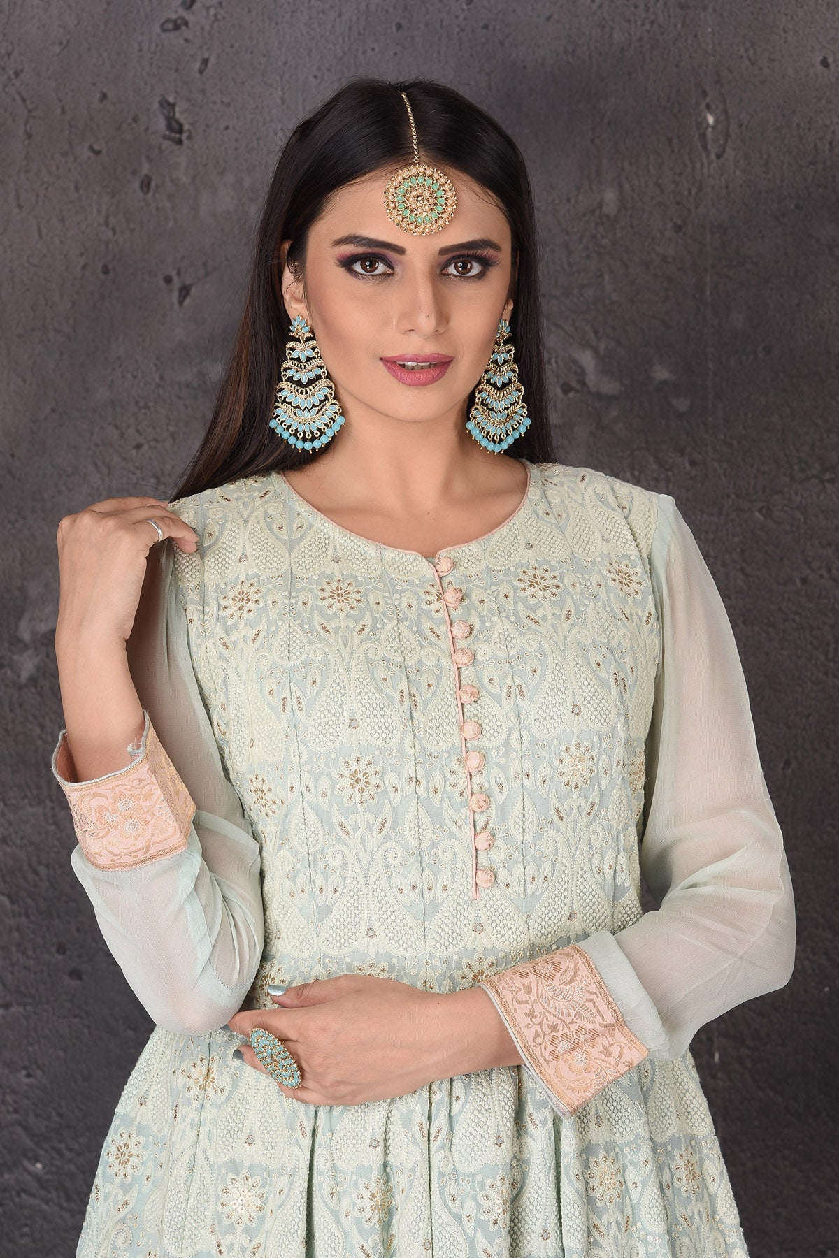 Buy gorgeous mint green embroidered sharara suit online in USA with pink dupatta. Look elegant at weddings and festive occasions in exclusive designer suits, designer gowns, Anarkali suits, sharara suits, bridal gowns, palazzo suits, designer lehenga from Pure Elegance Indian clothing store in USA.-closeup