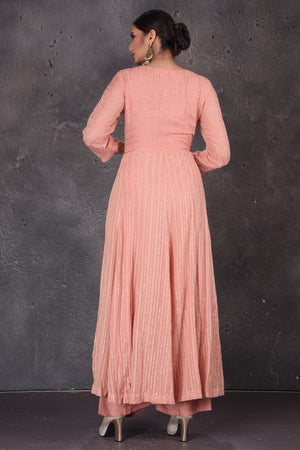 Shop stunning light pink Anarkali suit online in USA with palazzo and yellow dupatta. Look elegant at weddings and festive occasions in exclusive designer suits, designer gowns, Anarkali suits, sharara suits, bridal gowns, palazzo suits, designer lehenga from Pure Elegance Indian clothing store in USA.-back