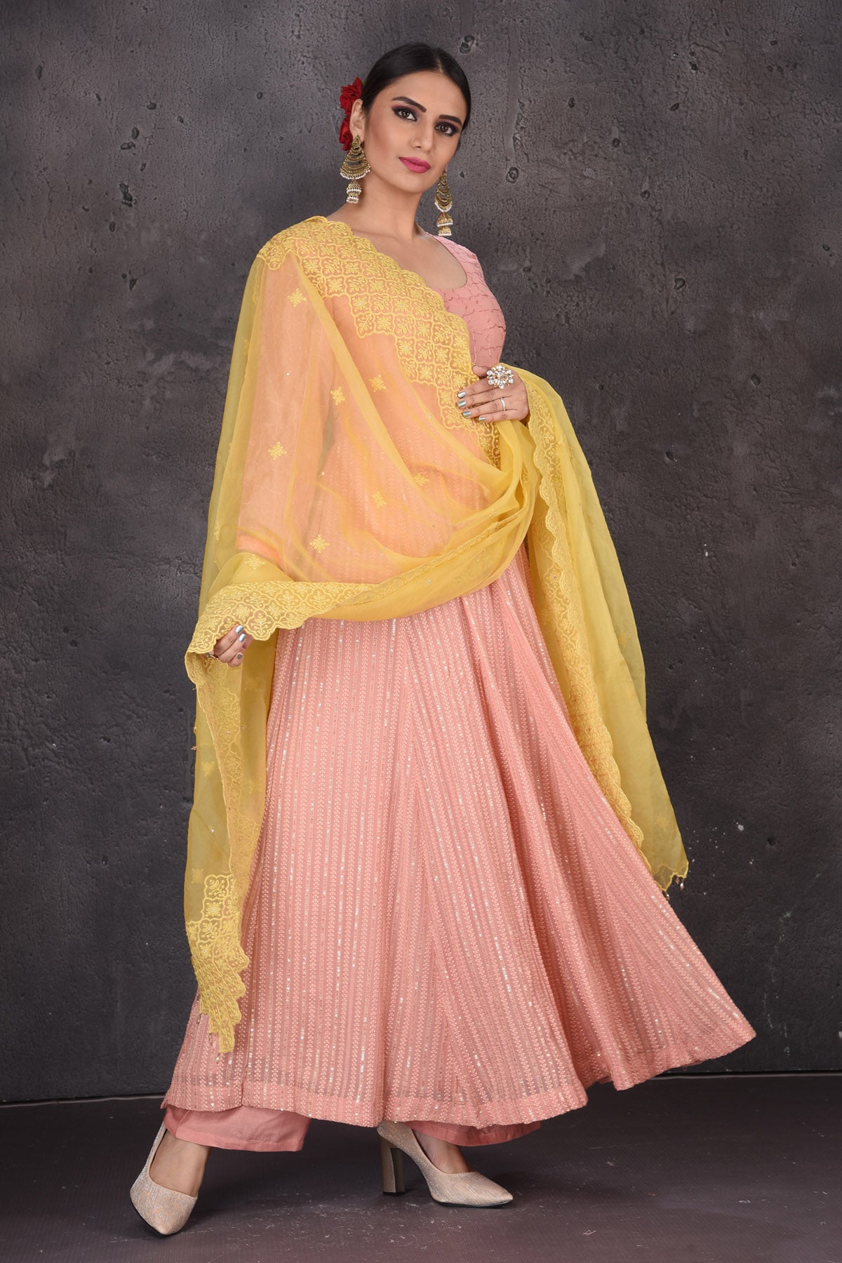 Shop stunning light pink Anarkali suit online in USA with palazzo and yellow dupatta. Look elegant at weddings and festive occasions in exclusive designer suits, designer gowns, Anarkali suits, sharara suits, bridal gowns, palazzo suits, designer lehenga from Pure Elegance Indian clothing store in USA.-suit