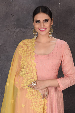 Shop stunning light pink Anarkali suit online in USA with palazzo and yellow dupatta. Look elegant at weddings and festive occasions in exclusive designer suits, designer gowns, Anarkali suits, sharara suits, bridal gowns, palazzo suits, designer lehenga from Pure Elegance Indian clothing store in USA.-closeup