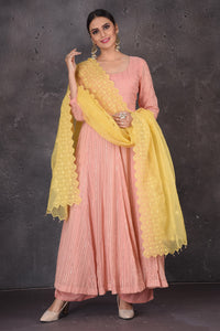 Shop stunning light pink Anarkali suit online in USA with palazzo and yellow dupatta. Look elegant at weddings and festive occasions in exclusive designer suits, designer gowns, Anarkali suits, sharara suits, bridal gowns, palazzo suits, designer lehenga from Pure Elegance Indian clothing store in USA.-full view