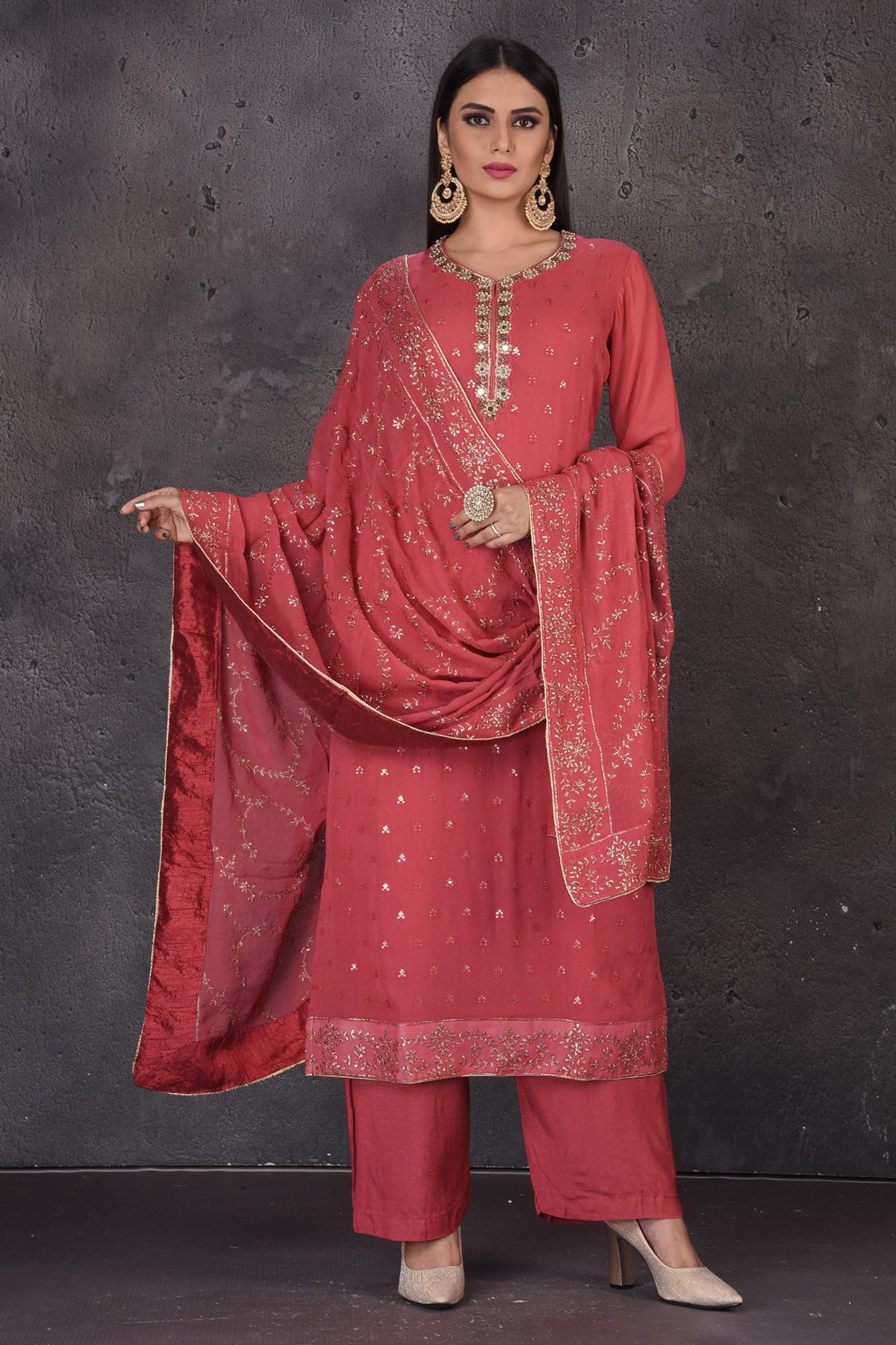 Buy beautiful rouge pink embroidered palazzo suit online in USA with dupatta. Look elegant at weddings and festive occasions in exclusive designer suits, designer gowns, Anarkali suits, sharara suits, bridal gowns, palazzo suits, designer lehenga from Pure Elegance Indian clothing store in USA.-full view