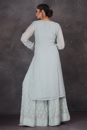 Buy gorgeous powder blue embroidered palazzo suit online in USA with dupatta. Look elegant at weddings and festive occasions in exclusive designer suits, designer gowns, Anarkali suits, sharara suits, bridal gowns, palazzo suits, designer lehenga from Pure Elegance Indian clothing store in USA.-back