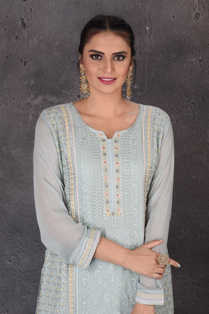 Buy gorgeous powder blue embroidered palazzo suit online in USA with dupatta. Look elegant at weddings and festive occasions in exclusive designer suits, designer gowns, Anarkali suits, sharara suits, bridal gowns, palazzo suits, designer lehenga from Pure Elegance Indian clothing store in USA.-closeup