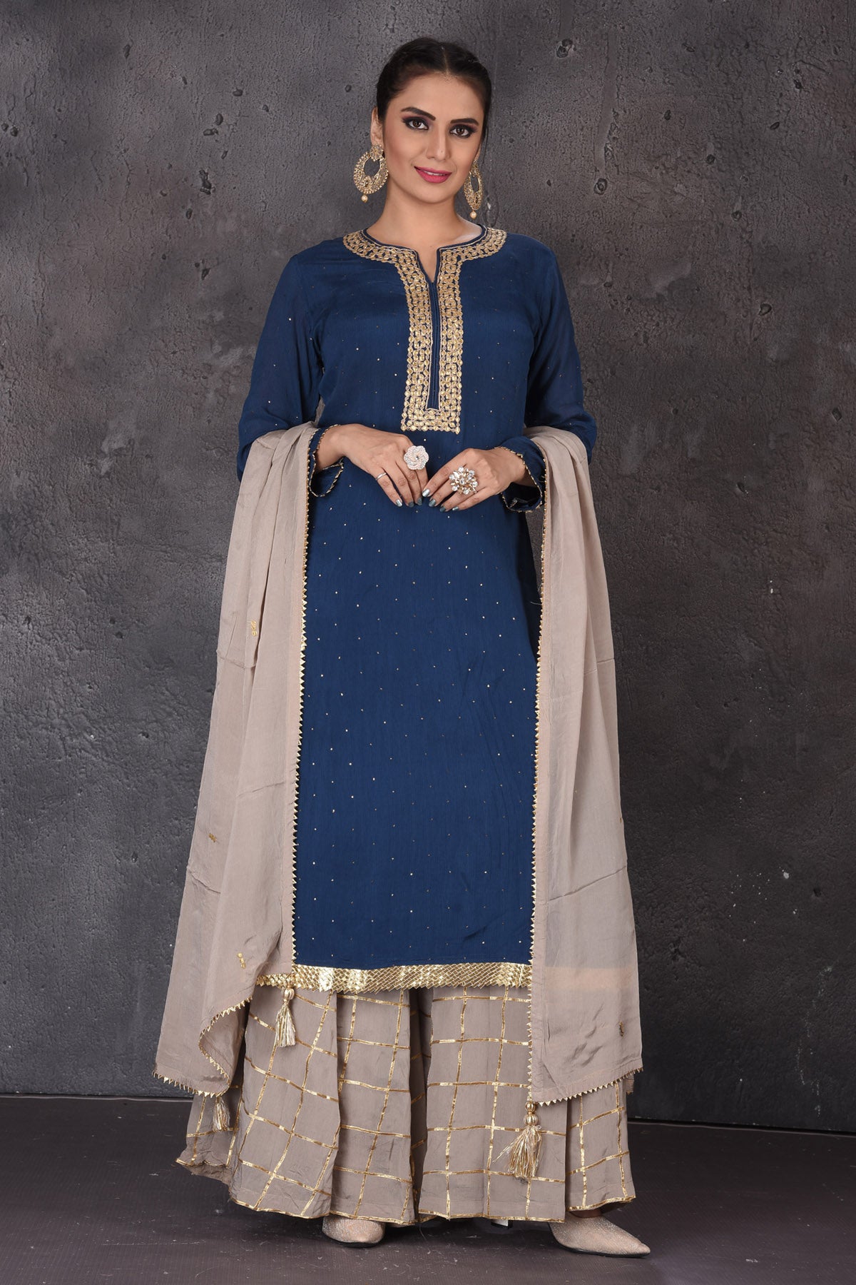 Buy beautiful blue and grey embroidered palazzo suit online in USA with dupatta. Look elegant at weddings and festive occasions in exclusive designer suits, designer gowns, Anarkali suits, sharara suits, bridal gowns, palazzo suits, designer lehenga from Pure Elegance Indian clothing store in USA.-full view