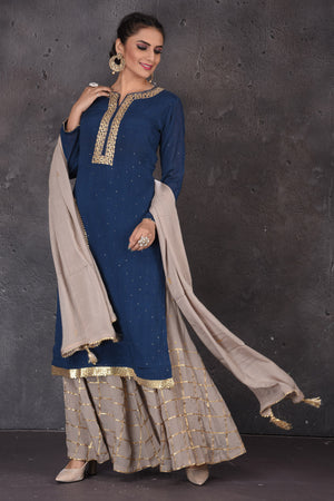 Buy beautiful blue and grey embroidered palazzo suit online in USA with dupatta. Look elegant at weddings and festive occasions in exclusive designer suits, designer gowns, Anarkali suits, sharara suits, bridal gowns, palazzo suits, designer lehenga from Pure Elegance Indian clothing store in USA.-palazzo