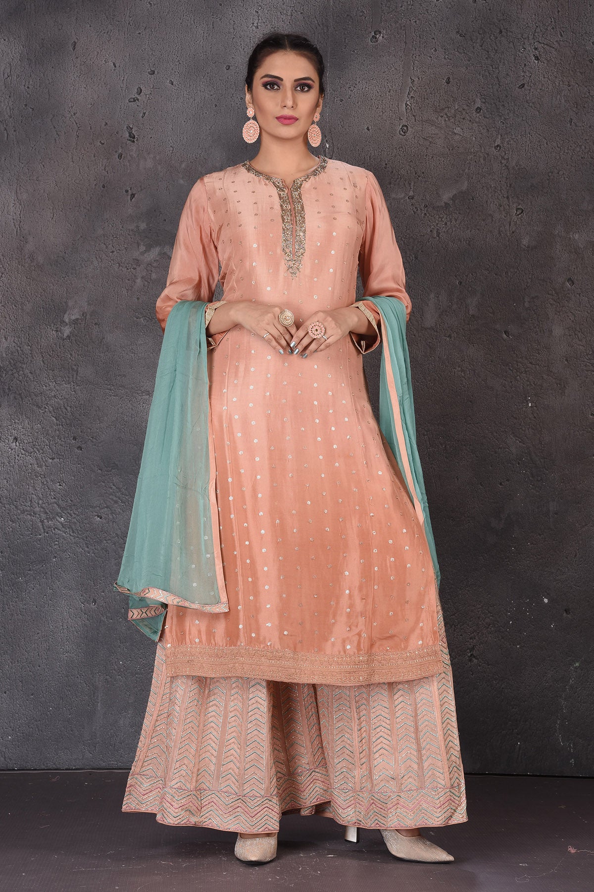 Buy stunning peach embroidered palazzo suit online in USA with blue dupatta. Look elegant at weddings and festive occasions in exclusive designer suits, designer gowns, Anarkali suits, sharara suits, bridal gowns, palazzo suits, designer lehenga from Pure Elegance Indian clothing store in USA.-full view