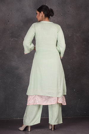 Buy beautiful mint green embroidered palazzo suit online in USA with pastel pink dupatta. Look elegant at weddings and festive occasions in exclusive designer suits, designer gowns, Anarkali suits, sharara suits, bridal gowns, palazzo suits, designer lehenga from Pure Elegance Indian clothing store in USA.-back