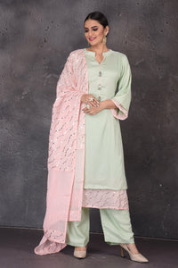 Buy beautiful mint green embroidered palazzo suit online in USA with pastel pink dupatta. Look elegant at weddings and festive occasions in exclusive designer suits, designer gowns, Anarkali suits, sharara suits, bridal gowns, palazzo suits, designer lehenga from Pure Elegance Indian clothing store in USA.-full view