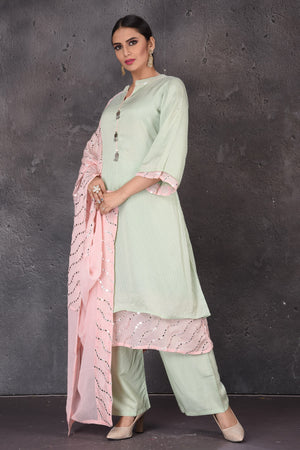 Buy beautiful mint green embroidered palazzo suit online in USA with pastel pink dupatta. Look elegant at weddings and festive occasions in exclusive designer suits, designer gowns, Anarkali suits, sharara suits, bridal gowns, palazzo suits, designer lehenga from Pure Elegance Indian clothing store in USA.-palazzo