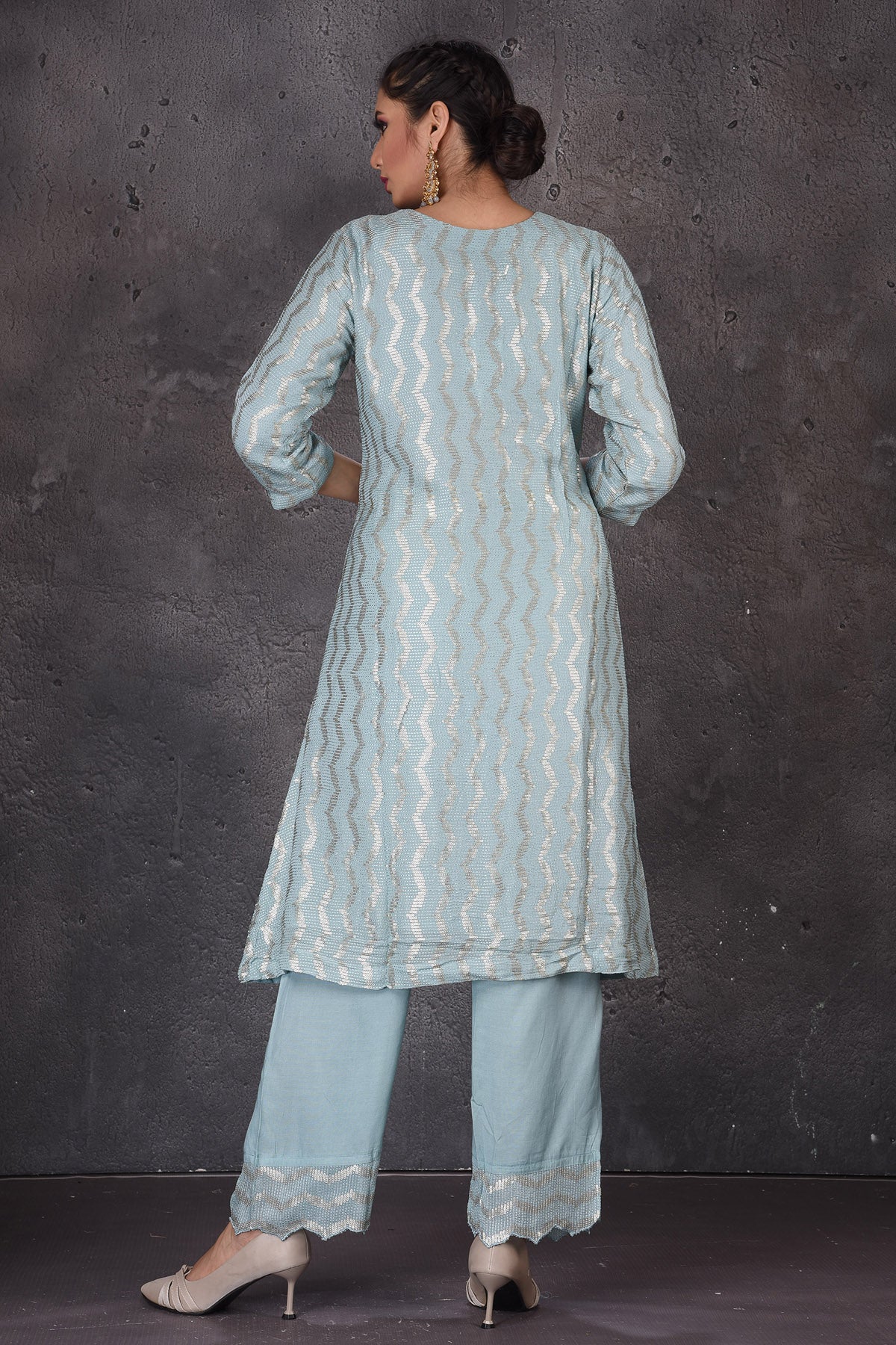 Buy stunning light blue embroidered palazzo suit online in USA with pink dupatta. Look elegant at weddings and festive occasions in exclusive designer suits, designer gowns, Anarkali suits, sharara suits, bridal gowns, palazzo suits, designer lehenga from Pure Elegance Indian clothing store in USA.-back