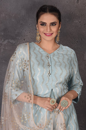 Buy stunning light blue embroidered palazzo suit online in USA with pink dupatta. Look elegant at weddings and festive occasions in exclusive designer suits, designer gowns, Anarkali suits, sharara suits, bridal gowns, palazzo suits, designer lehenga from Pure Elegance Indian clothing store in USA.-closeup