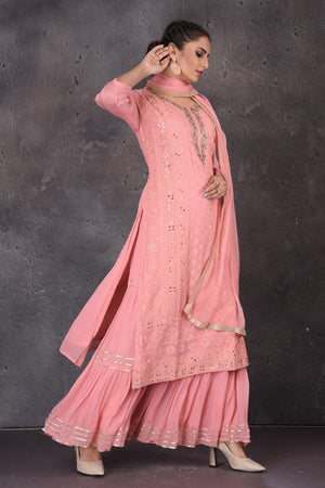 Buy beautiful pink gota embroidery palazzo suit online in USA with dupatta. Look elegant at weddings and festive occasions in exclusive designer suits, designer gowns, Anarkali suits, sharara suits, wedding gowns, palazzo suits, designer lehenga from Pure Elegance Indian clothing store in USA.-side