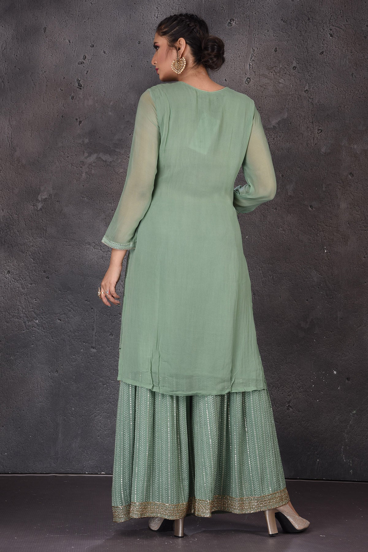 Shop beautiful green embroidered palazzo suit online in USA with dupatta. Look elegant at weddings and festive occasions in exclusive designer suits, designer gowns, Anarkali suits, sharara suits, wedding gowns, palazzo suits, designer lehenga from Pure Elegance Indian clothing store in USA.-back