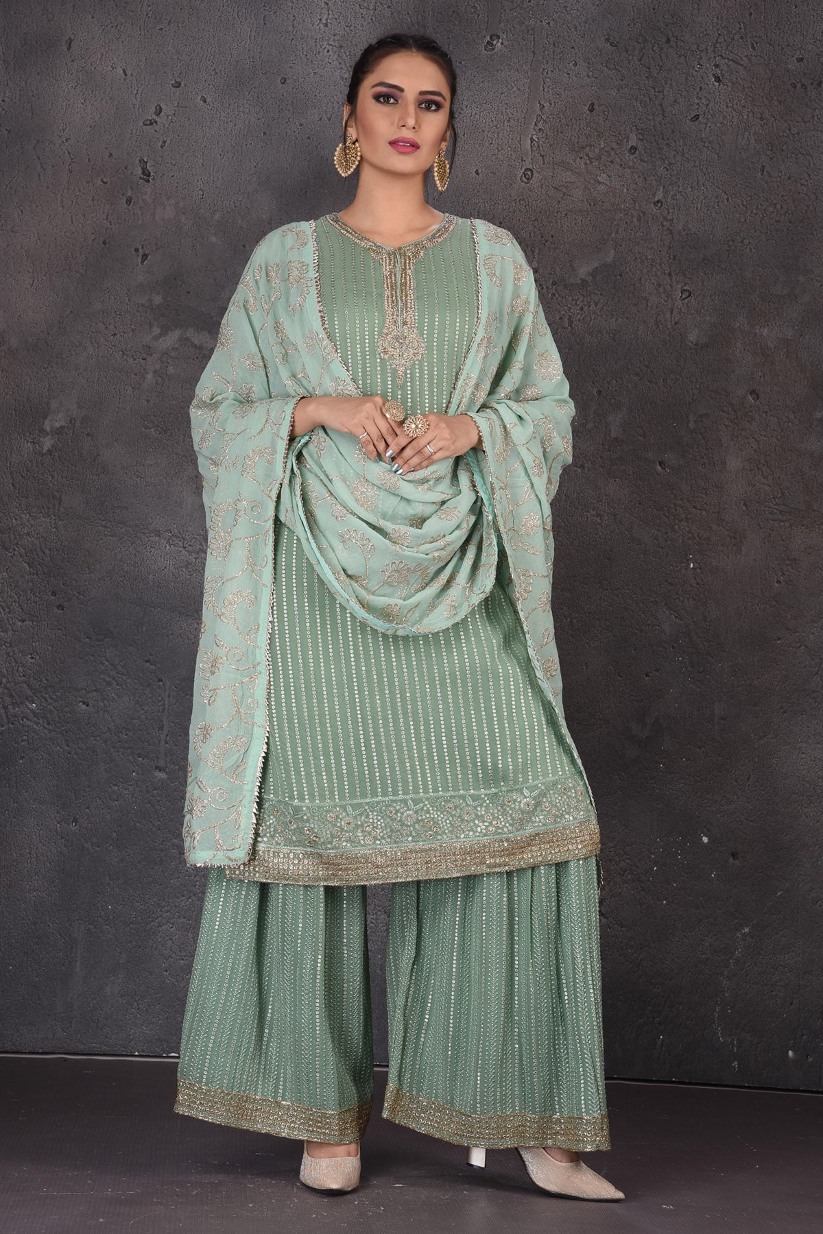 Shop beautiful green embroidered palazzo suit online in USA with dupatta. Look elegant at weddings and festive occasions in exclusive designer suits, designer gowns, Anarkali suits, sharara suits, wedding gowns, palazzo suits, designer lehenga from Pure Elegance Indian clothing store in USA.-full view