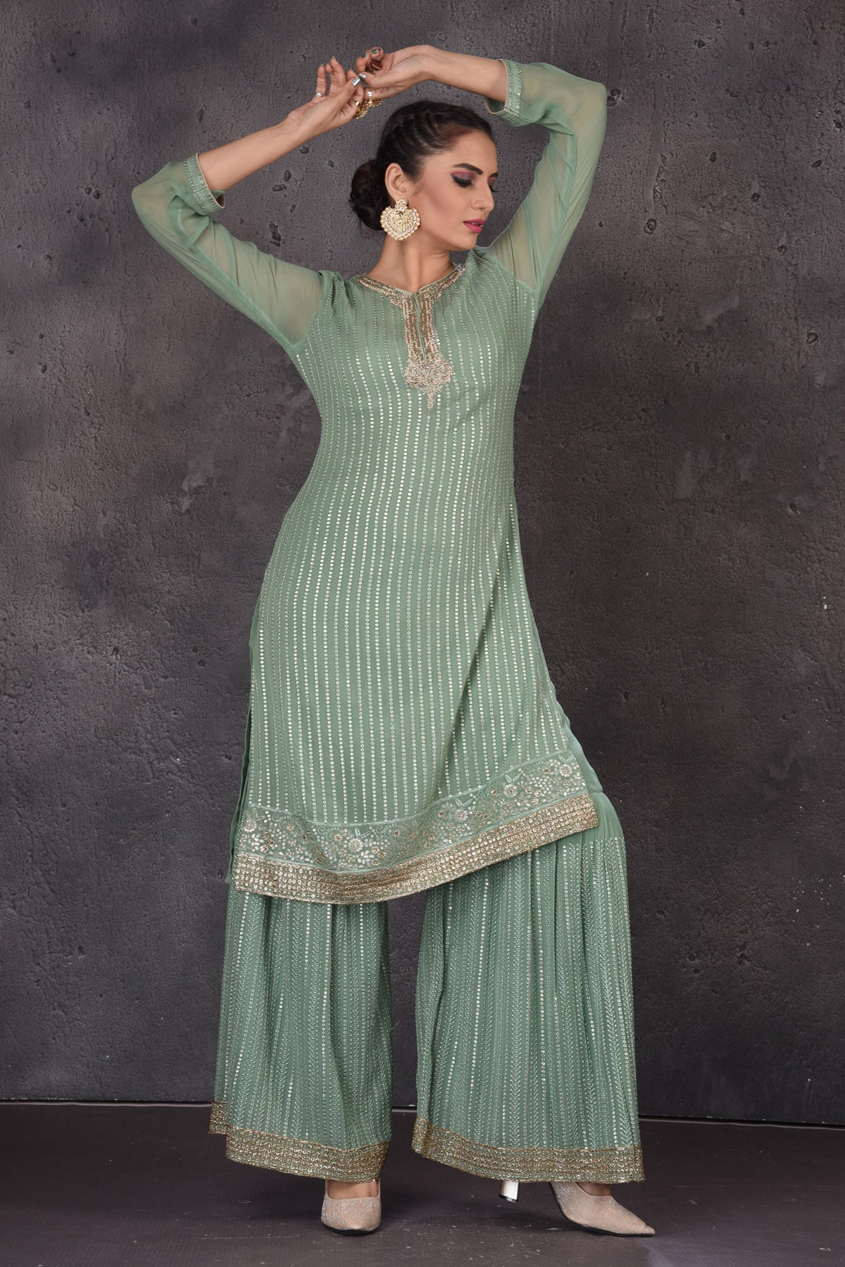 Shop beautiful green embroidered palazzo suit online in USA with dupatta. Look elegant at weddings and festive occasions in exclusive designer suits, designer gowns, Anarkali suits, sharara suits, wedding gowns, palazzo suits, designer lehenga from Pure Elegance Indian clothing store in USA.-kurta