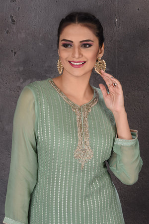 Shop beautiful green embroidered palazzo suit online in USA with dupatta. Look elegant at weddings and festive occasions in exclusive designer suits, designer gowns, Anarkali suits, sharara suits, wedding gowns, palazzo suits, designer lehenga from Pure Elegance Indian clothing store in USA.-closeup
