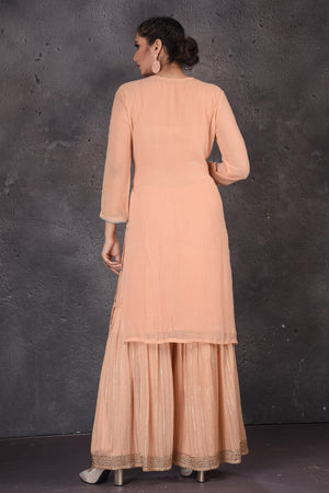 Buy beautiful peach embroidered palazzo suit online in USA with dupatta. Look elegant at weddings and festive occasions in exclusive designer suits, designer gowns, Anarkali suits, sharara suits, wedding gowns, palazzo suits, designer lehenga from Pure Elegance Indian clothing store in USA.-back