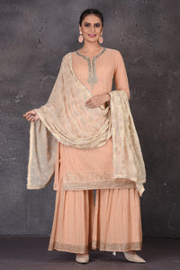 Buy beautiful peach embroidered palazzo suit online in USA with dupatta. Look elegant at weddings and festive occasions in exclusive designer suits, designer gowns, Anarkali suits, sharara suits, wedding gowns, palazzo suits, designer lehenga from Pure Elegance Indian clothing store in USA.-full view