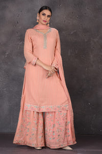 Shop beautiful blush pink embroidered palazzo suit online in USA with dupatta. Look elegant at weddings and festive occasions in exclusive designer suits, designer gowns, Anarkali suits, sharara suits, wedding gowns, palazzo suits, designer lehenga from Pure Elegance Indian clothing store in USA.-full view