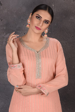 Shop beautiful blush pink embroidered palazzo suit online in USA with dupatta. Look elegant at weddings and festive occasions in exclusive designer suits, designer gowns, Anarkali suits, sharara suits, wedding gowns, palazzo suits, designer lehenga from Pure Elegance Indian clothing store in USA.-closeup