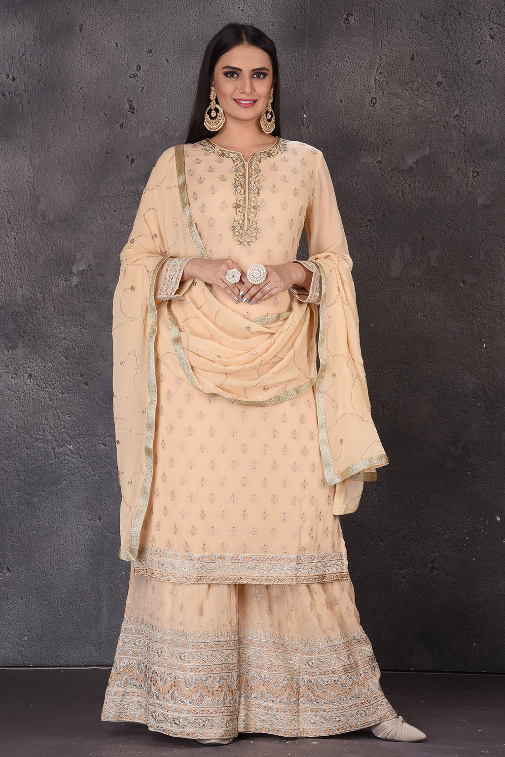 Shop stunning cream embroidered designer palazzo suit online in USA with dupatta. Look elegant at weddings and festive occasions in exclusive designer suits, designer gowns, Anarkali suits, sharara suits, wedding gowns, palazzo suits, designer lehenga from Pure Elegance Indian clothing store in USA.-full view