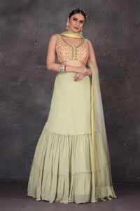 Buy beautiful pista green and yellow designer lehenga online in USA with dupatta. Look elegant at weddings and festive occasions in exclusive designer suits, designer gowns, Anarkali suits, sharara suits, wedding gowns, palazzo suits, designer lehenga from Pure Elegance Indian clothing store in USA.-full view