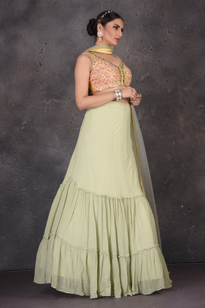Buy beautiful pista green and yellow designer lehenga online in USA with dupatta. Look elegant at weddings and festive occasions in exclusive designer suits, designer gowns, Anarkali suits, sharara suits, wedding gowns, palazzo suits, designer lehenga from Pure Elegance Indian clothing store in USA.-skirt