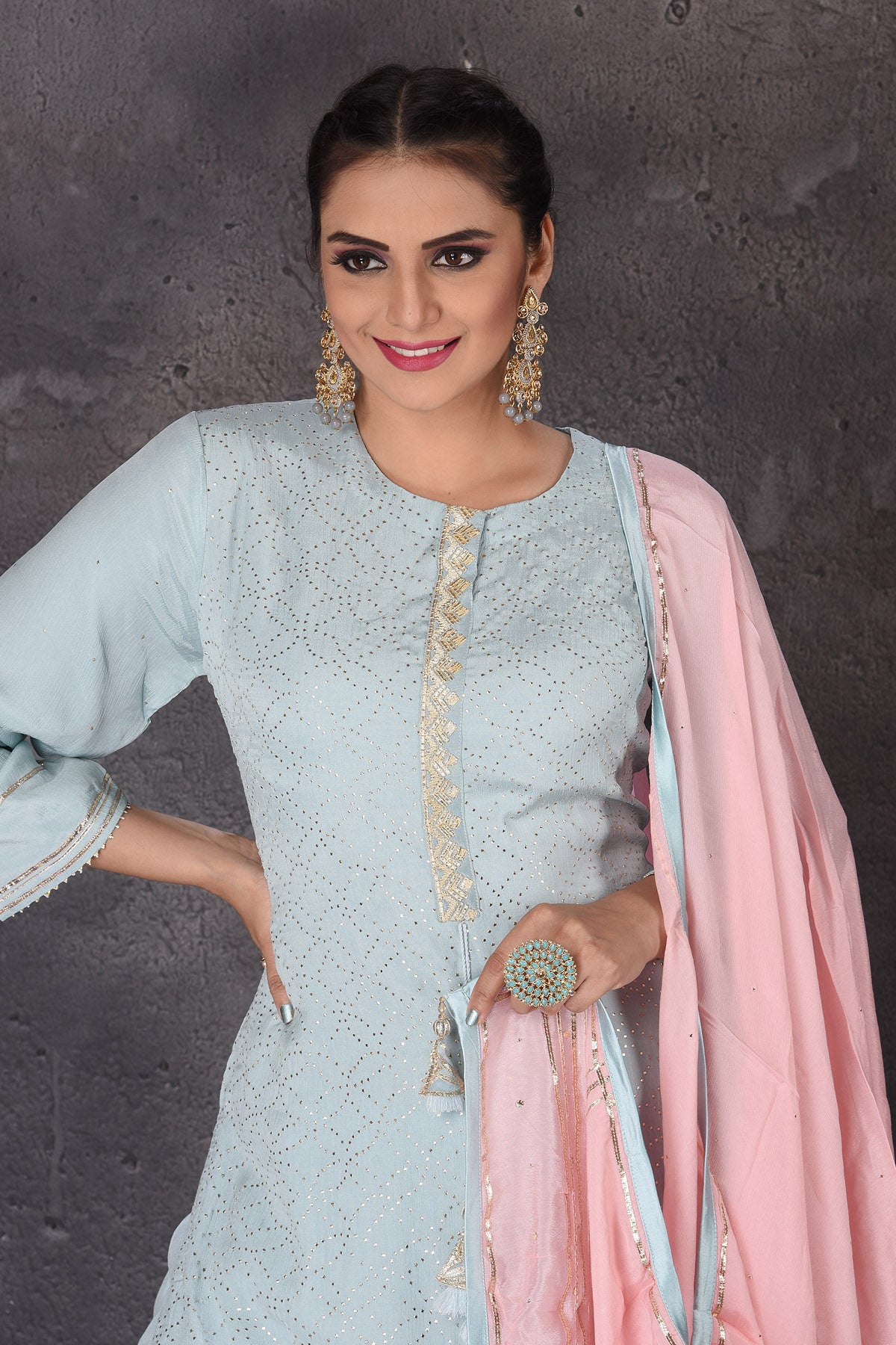 Buy beautiful pastel blue embroidered sharara suit online in USA with pink dupatta. Look elegant at weddings and festive occasions in exclusive designer suits, designer gowns, Anarkali suits, sharara suits, wedding gowns, palazzo suits, designer lehenga from Pure Elegance Indian clothing store in USA.-closeup