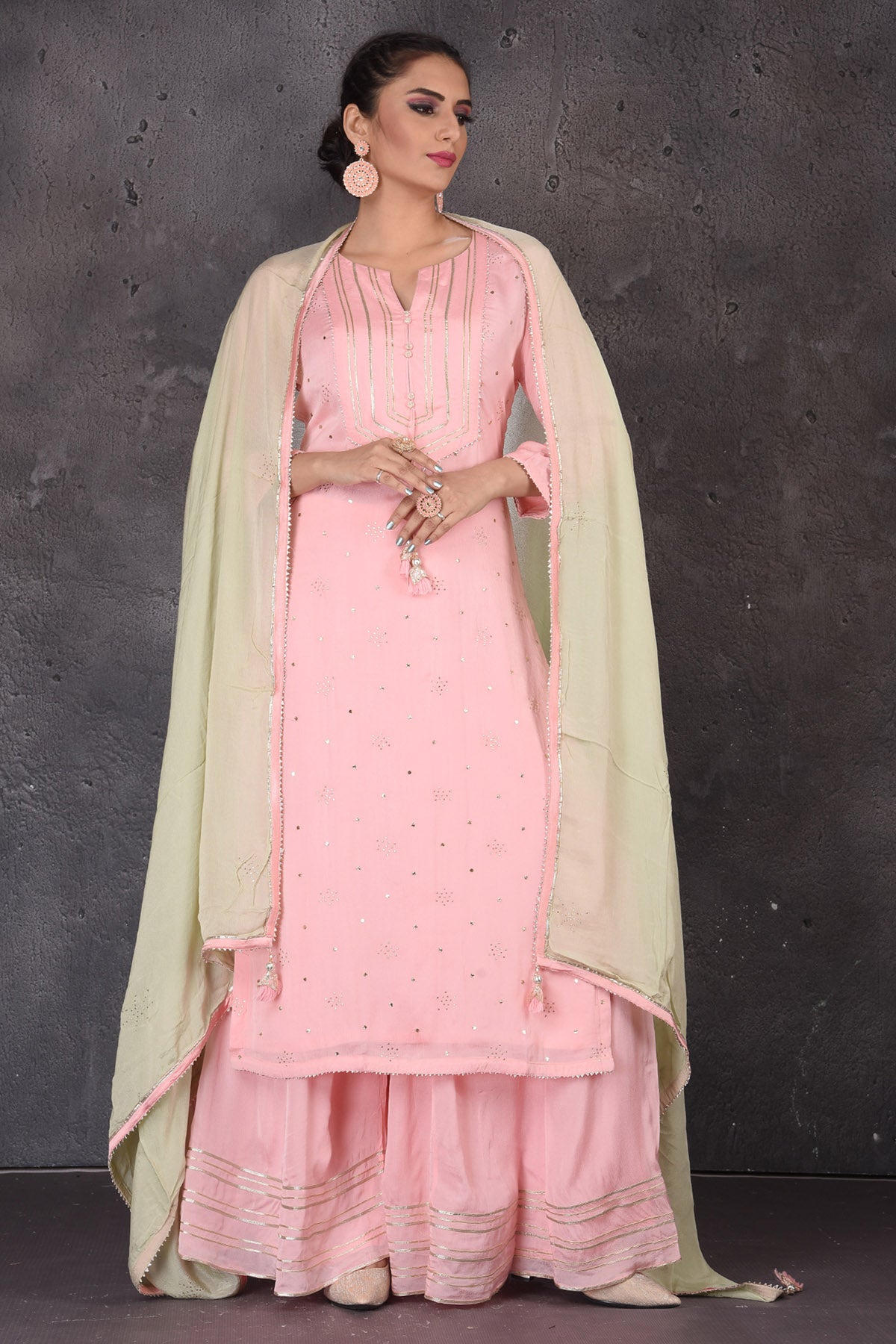 Shop stunning pastel pink gota work palazzo suit online in USA with pastel green dupatta. Look elegant at weddings and festive occasions in exclusive designer suits, designer gowns, Anarkali suits, sharara suits, wedding gowns, palazzo suits, designer lehenga from Pure Elegance Indian clothing store in USA.-full view