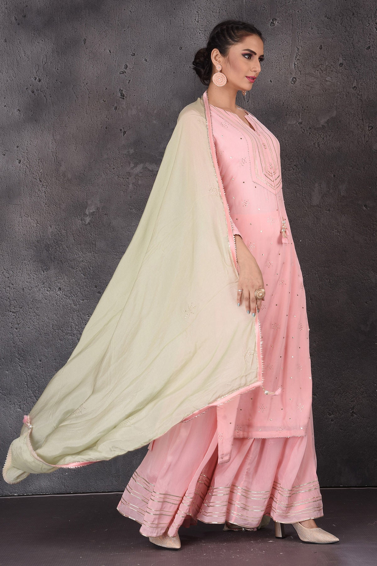 Shop stunning pastel pink gota work palazzo suit online in USA with pastel green dupatta. Look elegant at weddings and festive occasions in exclusive designer suits, designer gowns, Anarkali suits, sharara suits, wedding gowns, palazzo suits, designer lehenga from Pure Elegance Indian clothing store in USA.-side