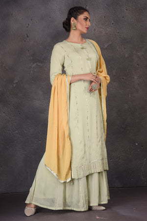 Shop beautiful pista green embellished palazzo suit online in USA with yellow dupatta. Look elegant at weddings and festive occasions in exclusive designer suits, designer gowns, Anarkali suits, sharara suits, wedding gowns, palazzo suits, designer lehenga from Pure Elegance Indian clothing store in USA.-side
