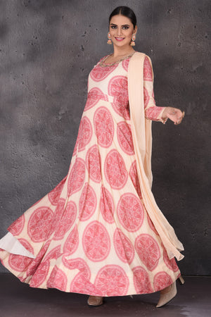 Shop stunning cream printed embroidered floorlength Anarkali online in USA with dupatta. Look elegant at weddings and festive occasions in exclusive designer suits, designer gowns, Anarkali suits, sharara suits, wedding gowns, palazzo suits, designer lehenga from Pure Elegance Indian clothing store in USA.-side