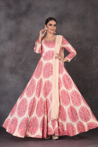 Shop stunning cream printed embroidered floorlength Anarkali online in USA with dupatta. Look elegant at weddings and festive occasions in exclusive designer suits, designer gowns, Anarkali suits, sharara suits, wedding gowns, palazzo suits, designer lehenga from Pure Elegance Indian clothing store in USA.-full view